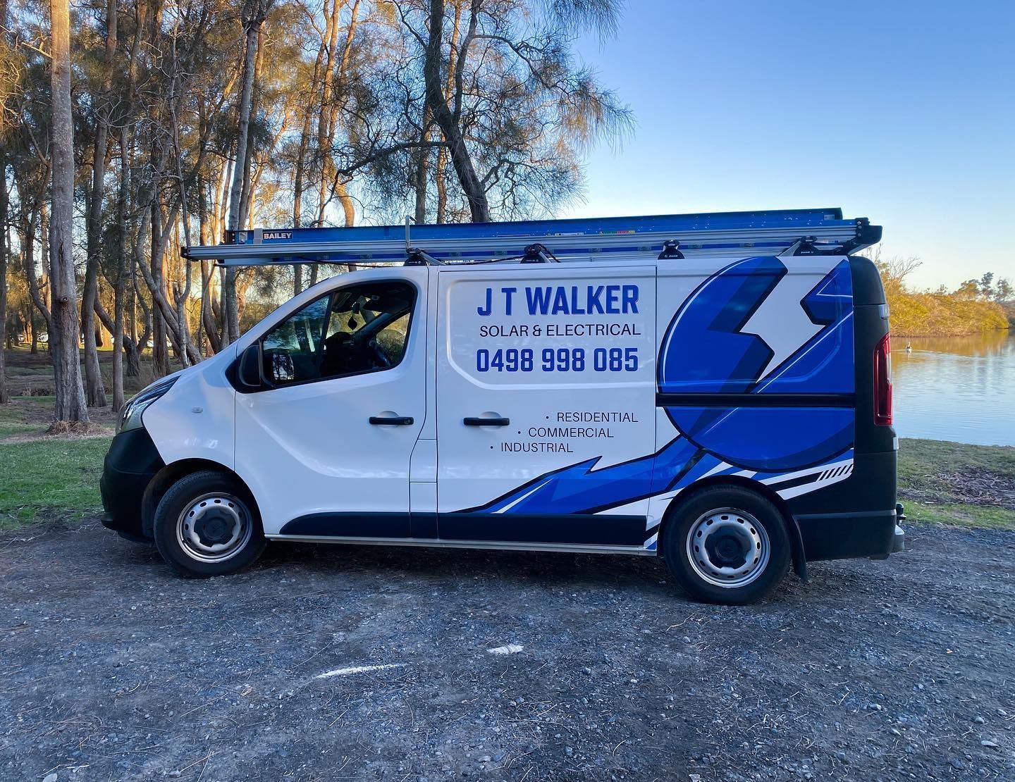 A white J T Walker van is parked in a parking lot — J T Walker Electrical In Taree, NSW