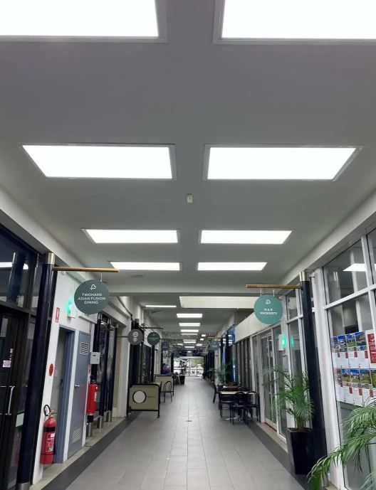 A Long Hallway With Lots of Lights on the Ceiling — J T Walker Electrical In Taree, NSW
