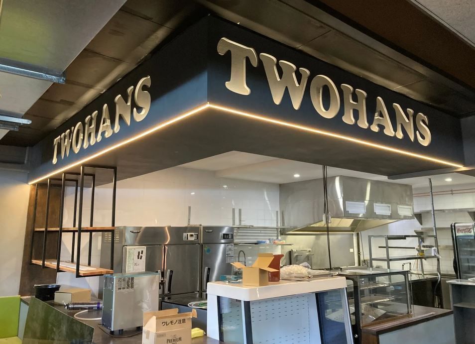 A Kitchen With a Sign That Says Twohans on It — J T Walker Electrical In Taree, NSW