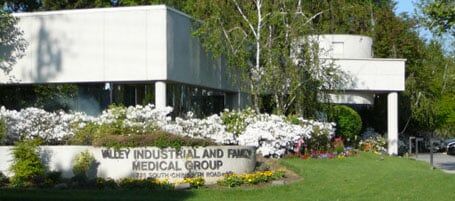 Nurse holding hand of senior woman - Medical Services in Visalia, CA