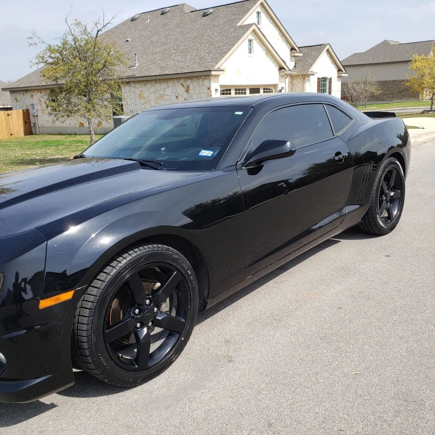 Sandstone canyon walls in shades of red and orange, with light streaming from above.