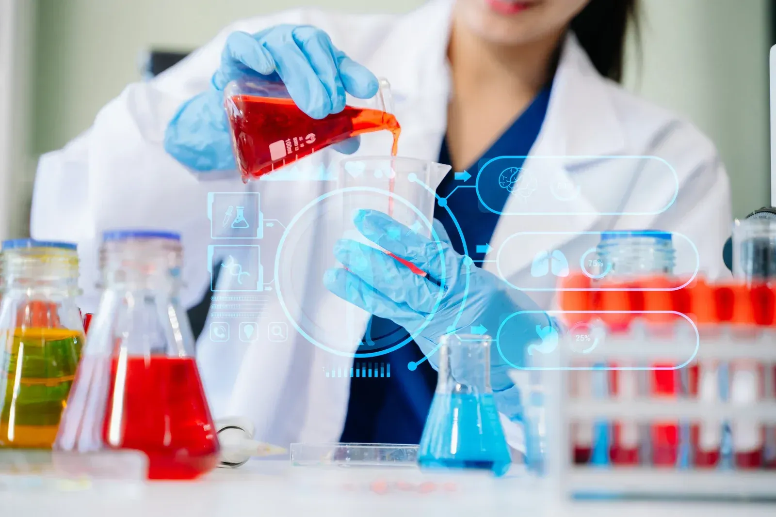 Scientist pours red liquid into a beaker, surrounded by colorful lab equipment.