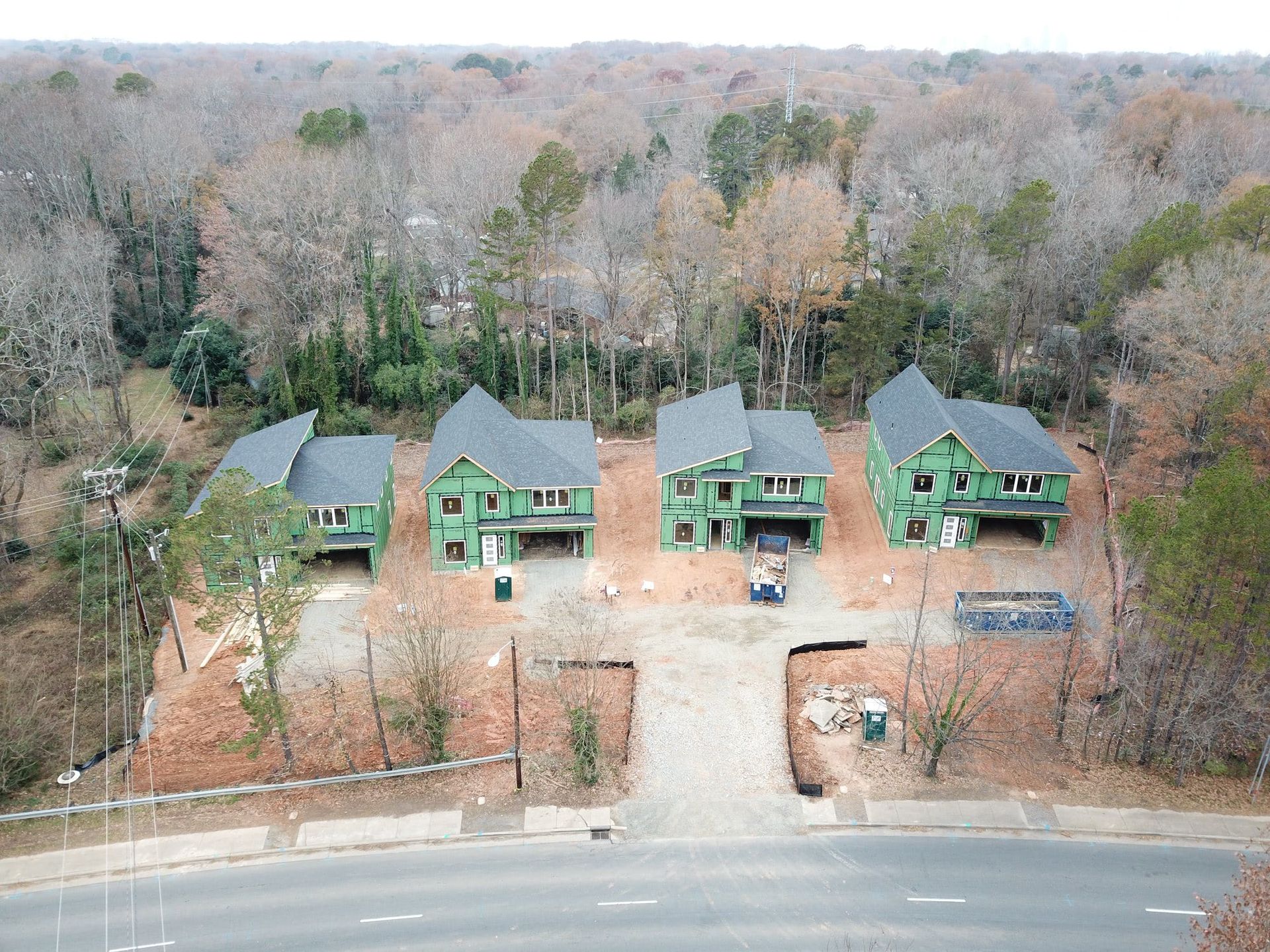 an aerial view of a house under construction in the woods