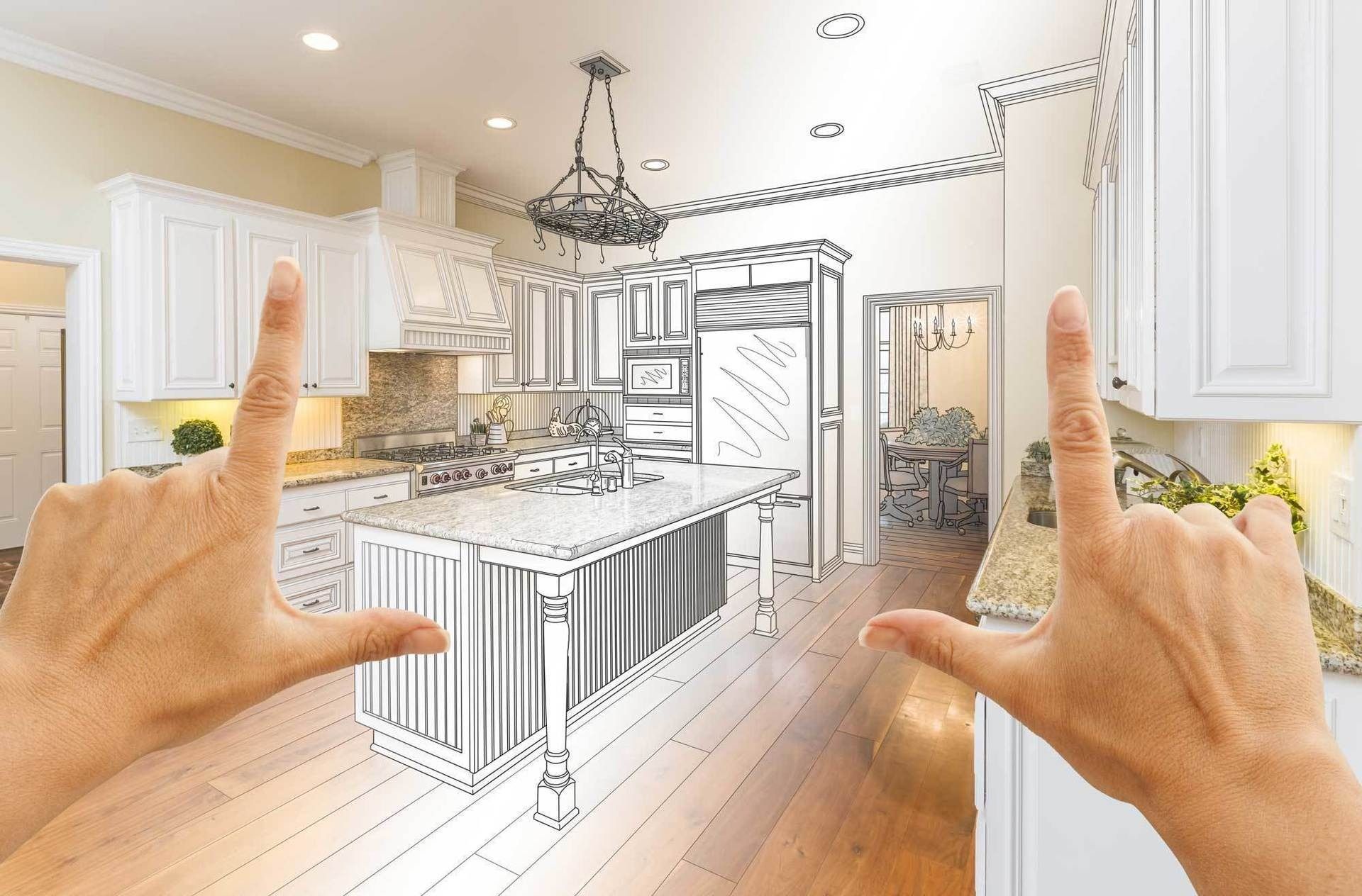 A person's hands frame a kitchen scene where a realistic view blends into a black-and-white architectural sketch.