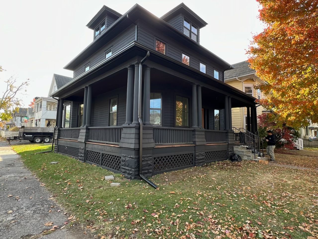 A large house with a balcony on the side of it