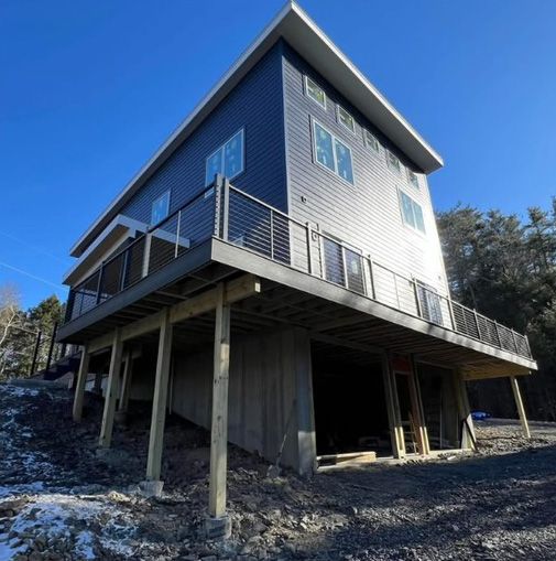 A large house with a balcony on the side of it