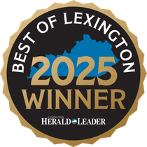 A gold and black badge reading