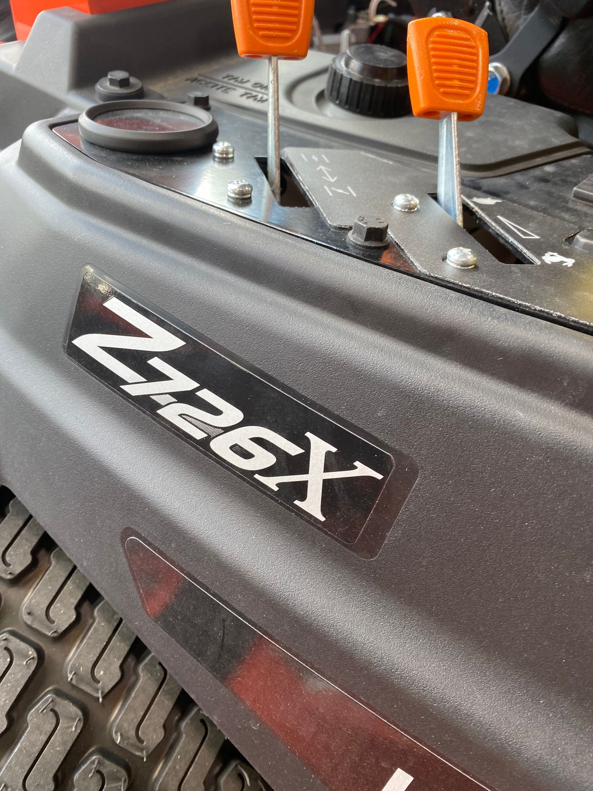 Close-up of a black zero-turn mower with 