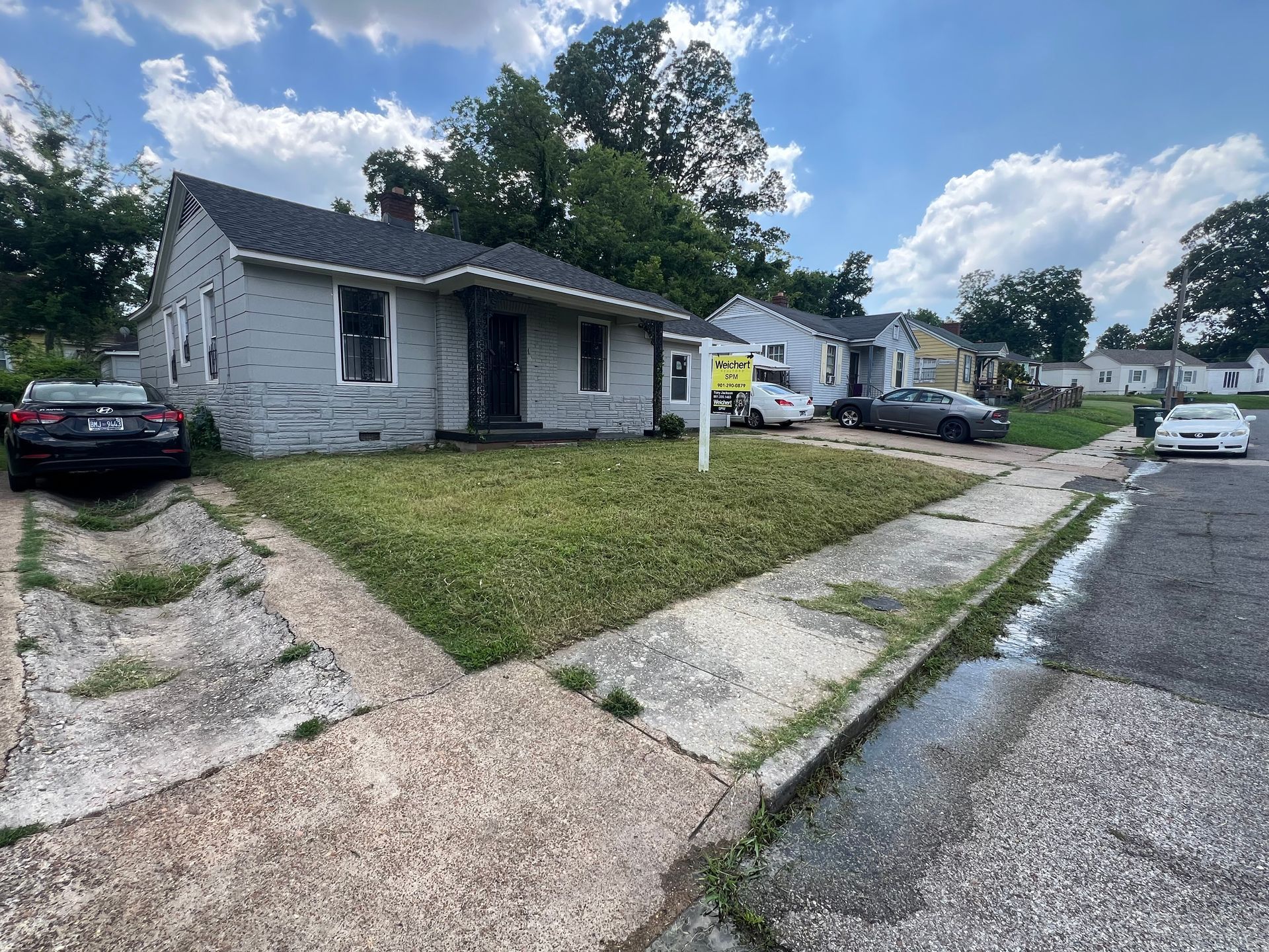 Gray house for sale with a 