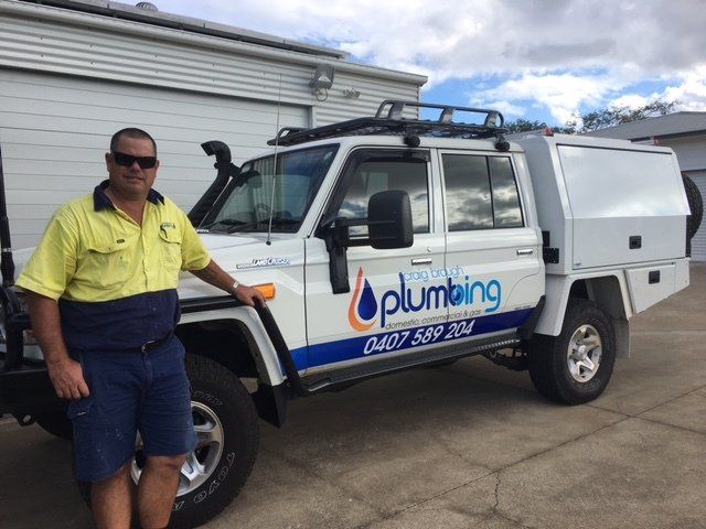 Craig Brough in front of his work ute — Plumbing And Gas Services In Bundaberg, QLD
