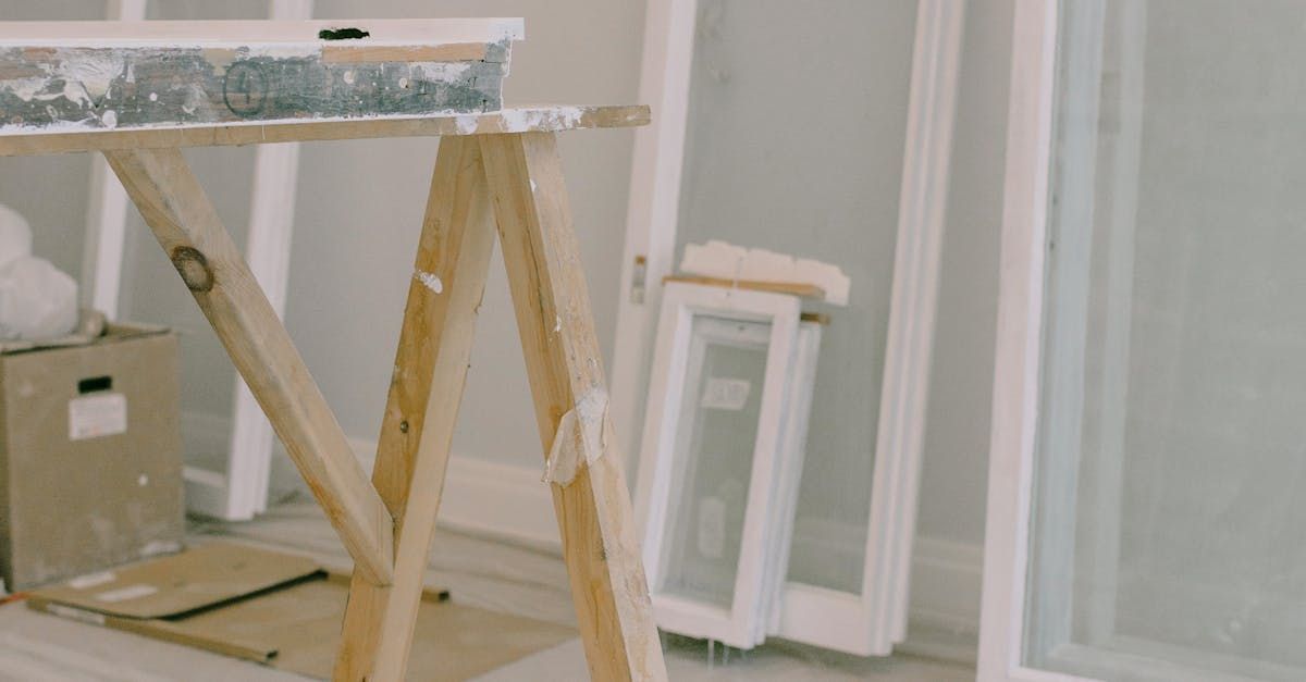 Water damaged residential living room in Charlotte NC with warped flooring and restoration equipment