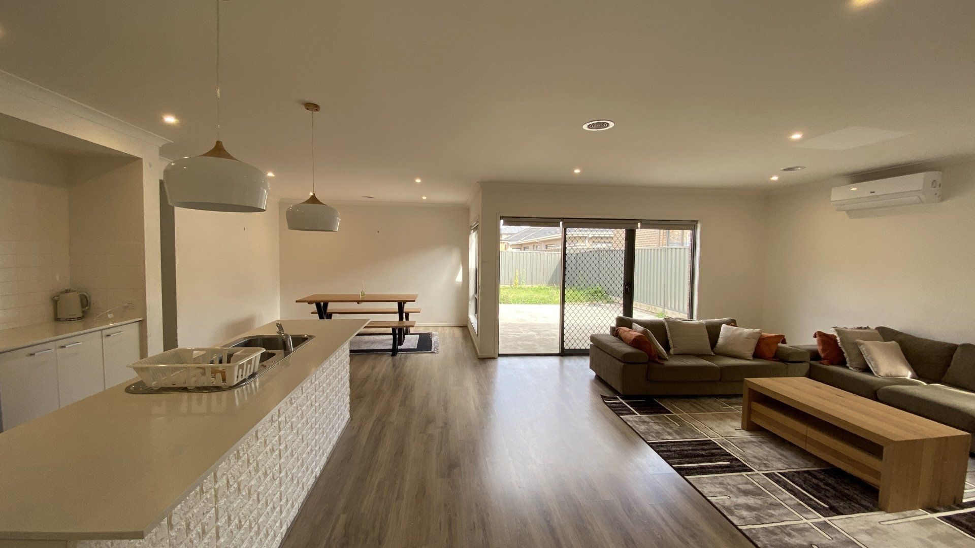 A living room with a couch and a table in it