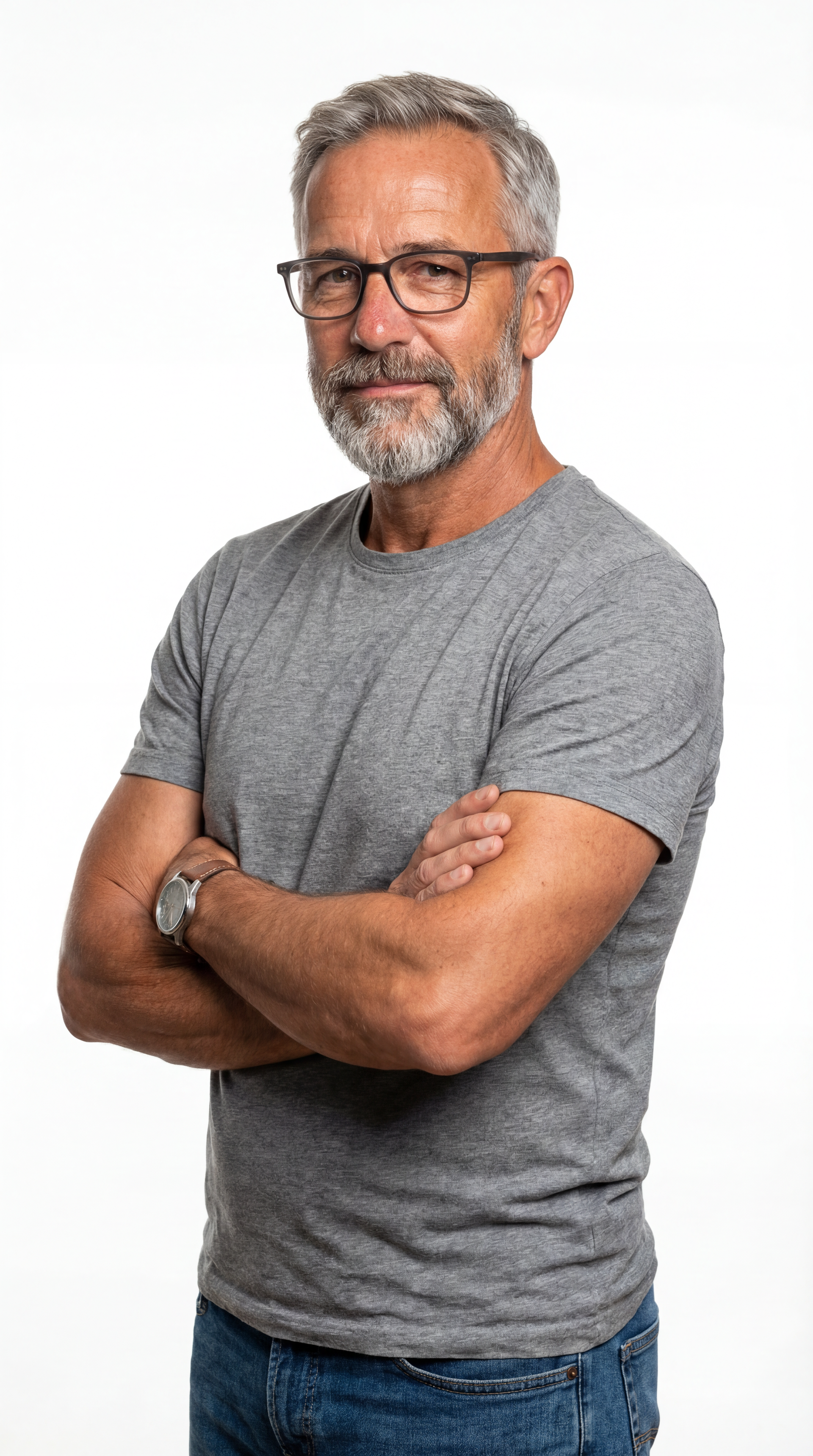 Man with gray hair and beard, wearing glasses and a gray t-shirt, arms crossed. Showing model creation in Ai.