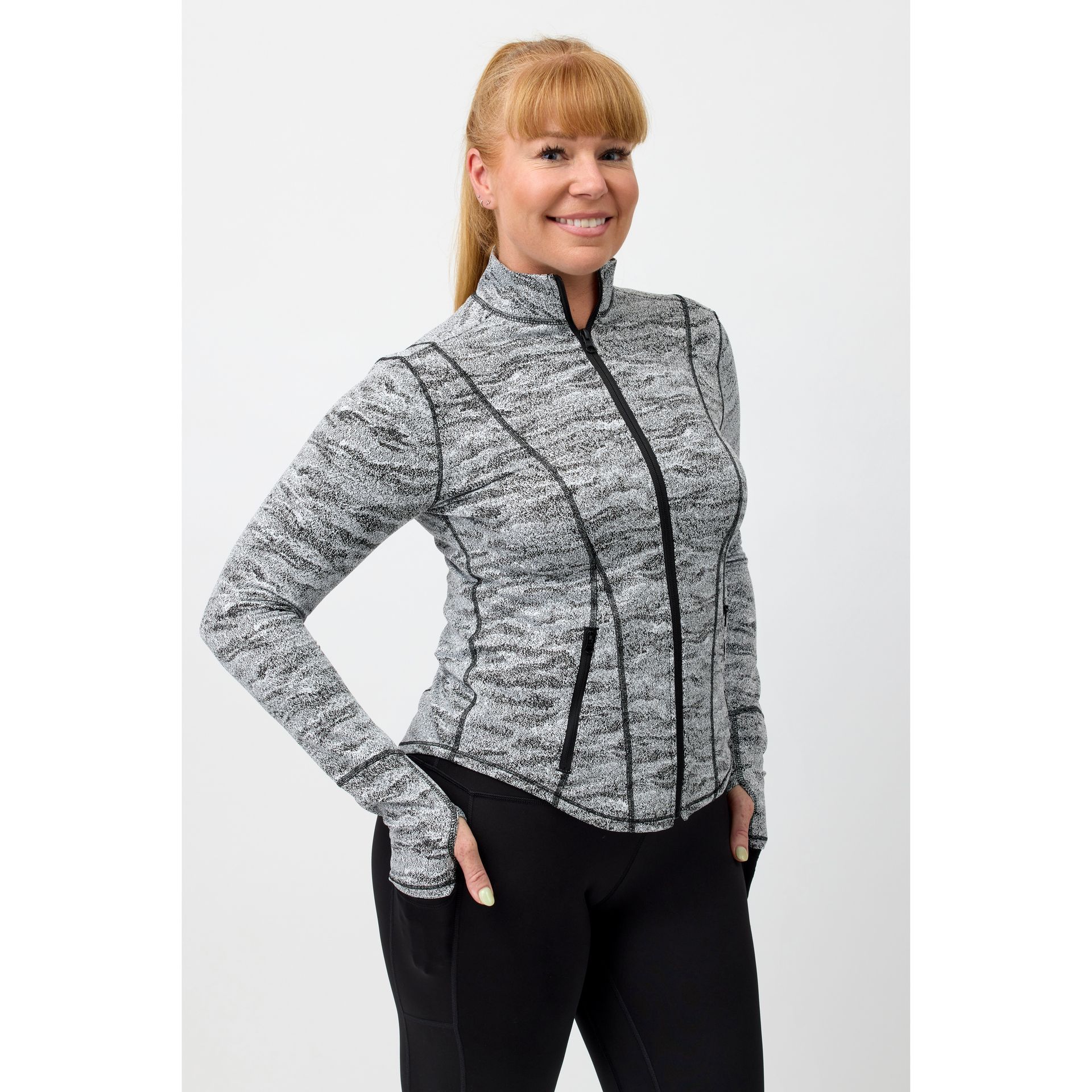 Lady wearing stunning skim fitting black and white training jacket designed by Happy Healthy Fitness
