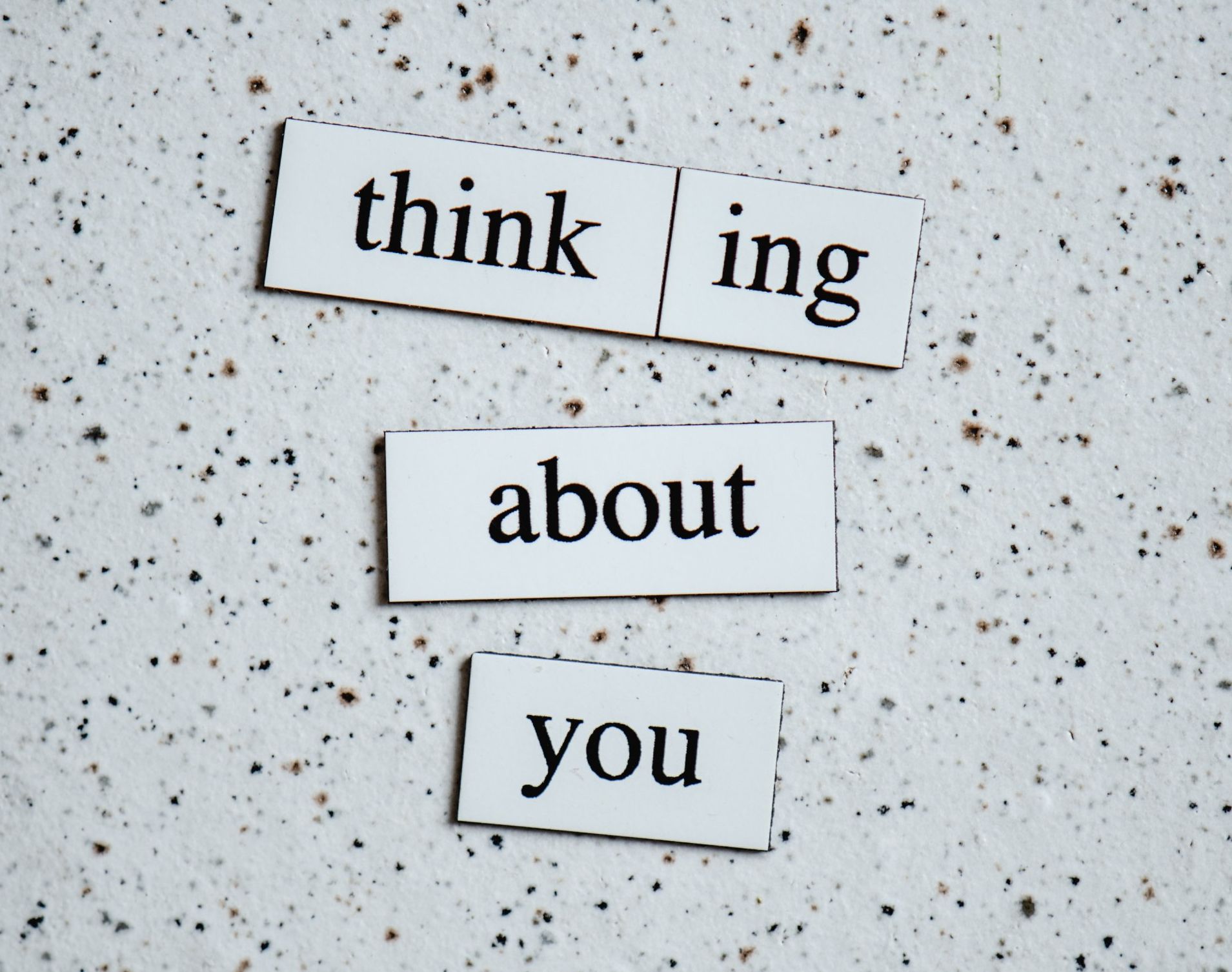the words thinking about you showing in an image