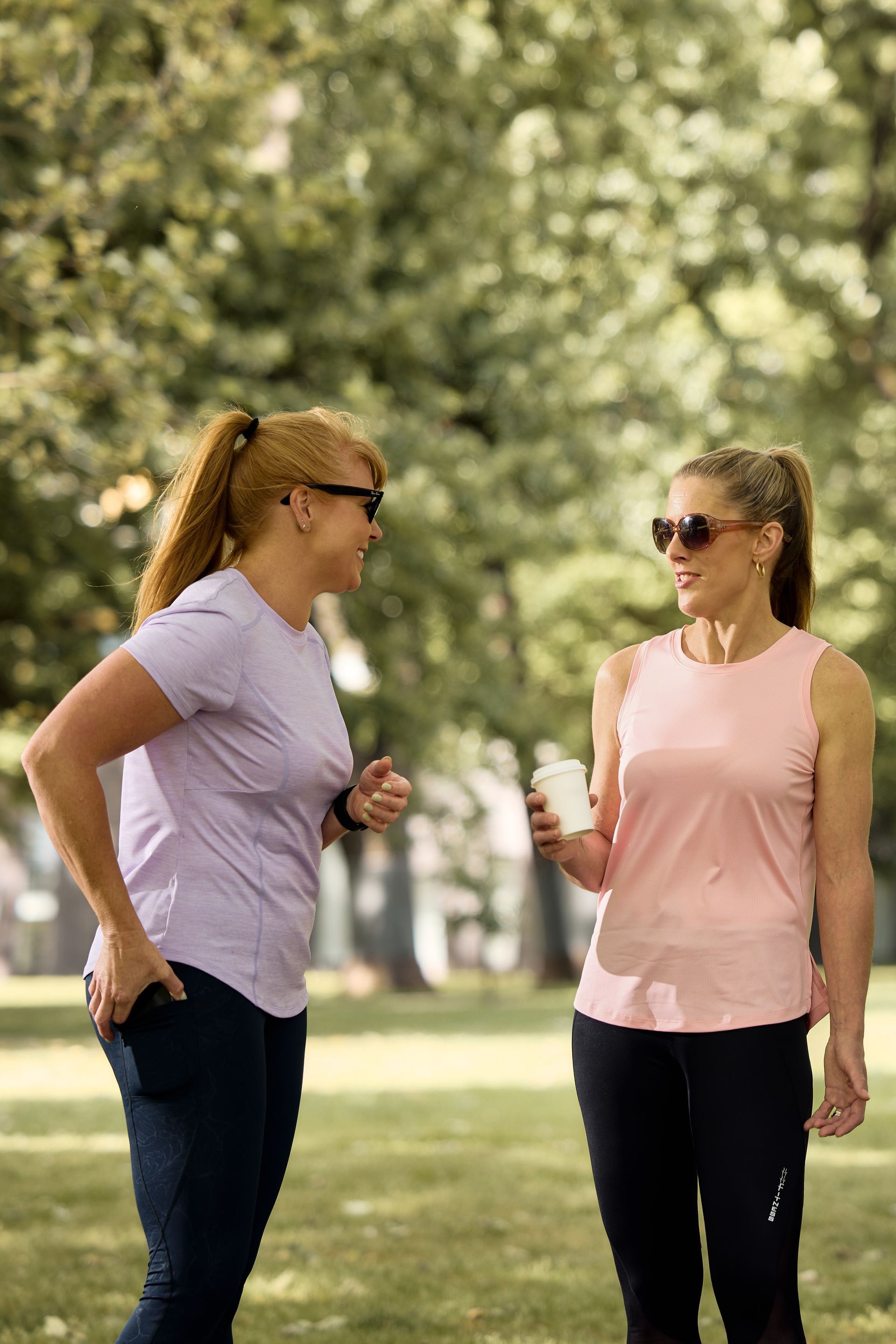 Lady in the park doing training exercises and wearing stunning Happy Healthy Fitness activewear