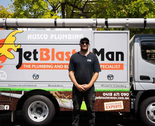 Jet Blaster Man's car parked in front of a house
