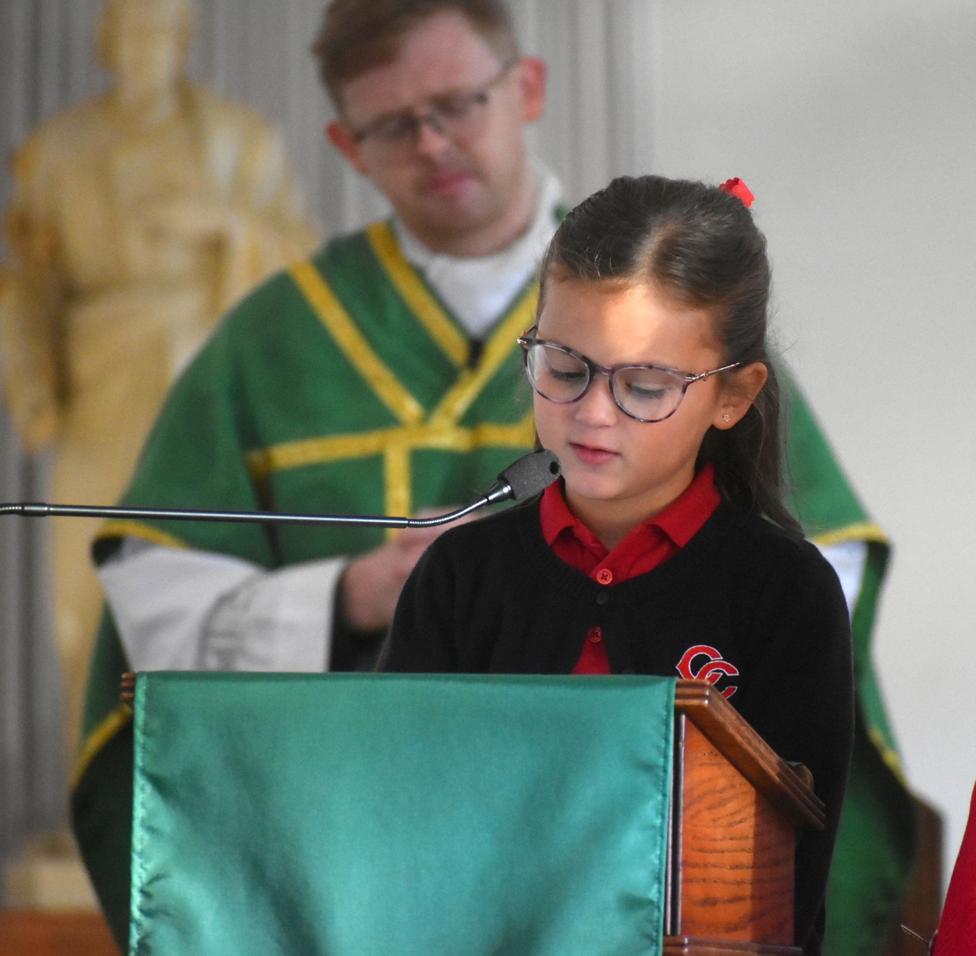 A baseball player is swinging his bat at a ball