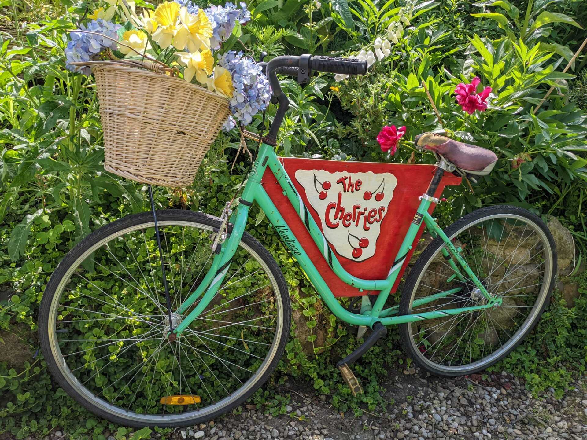 green bike  with wicker basket