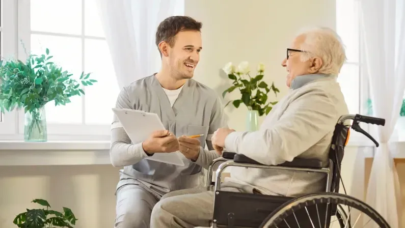 Happy wheelchair senior man with kind medical brother, consultant nursing, health and social care of elderly people, doctor, male geriatric nurse helping, healthcare hospital for old patient