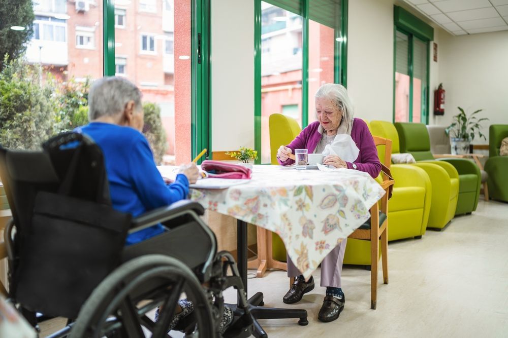 Senior women residents engaging in activities at a care facility