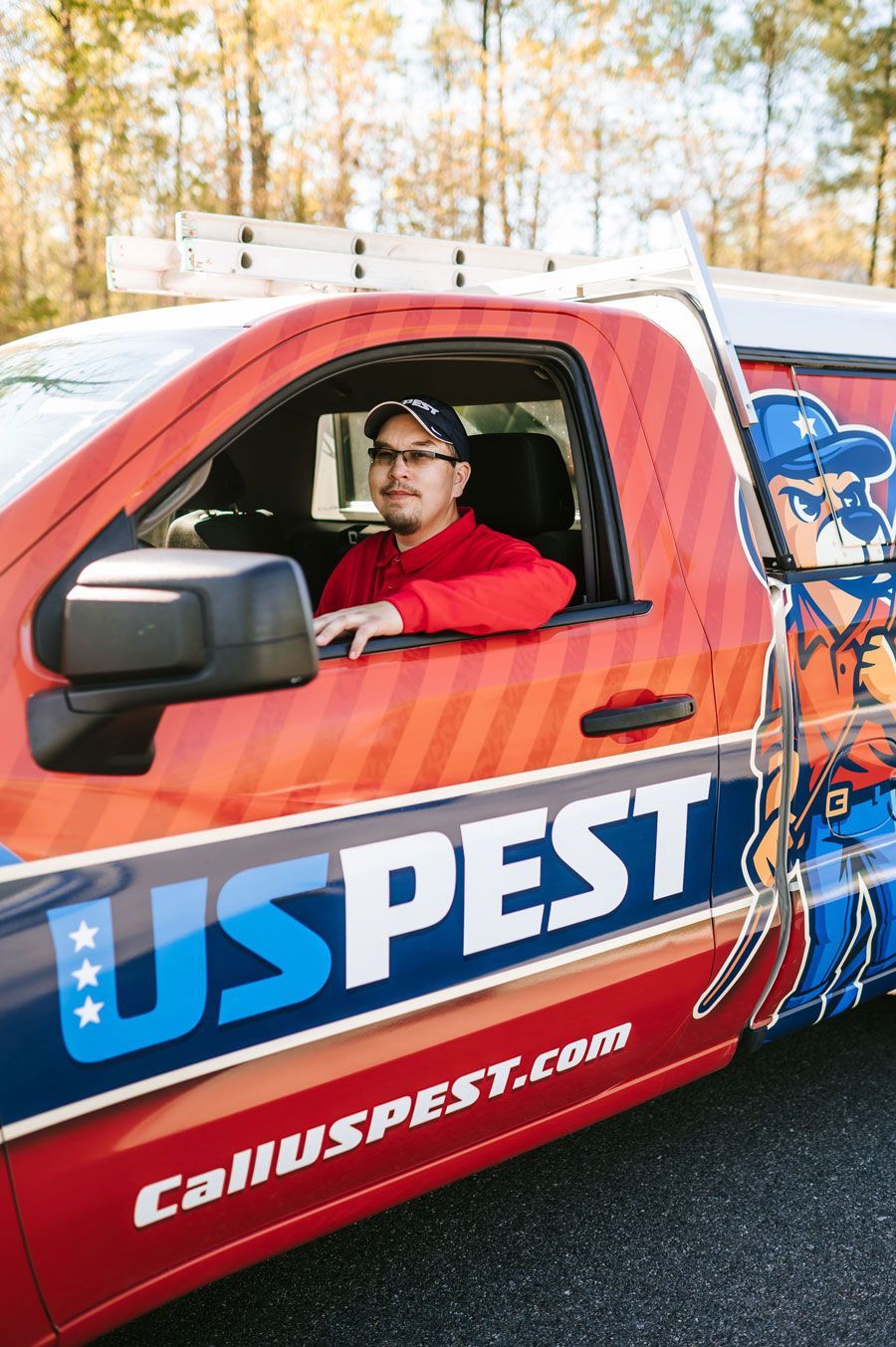a group of people are sitting at desks in an office