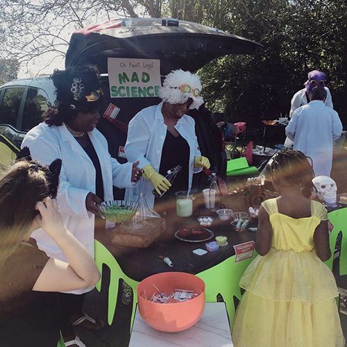 People in lab coats at a 