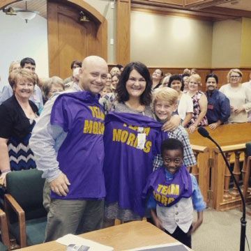 Family wearing purple 