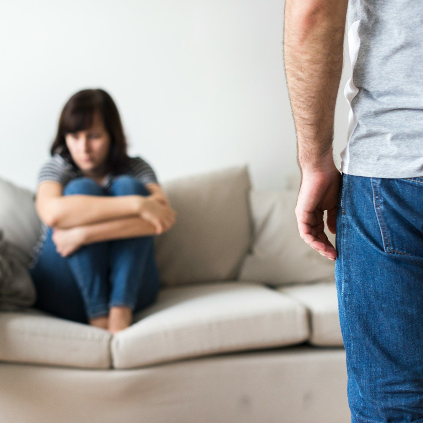 A man is carrying a little boy on his back.