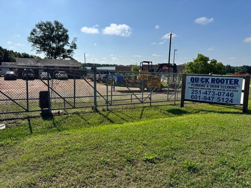 Plumber is Fixing a Sink in the Kitchen – Mobile, AL – Quick Rooter Plumbing