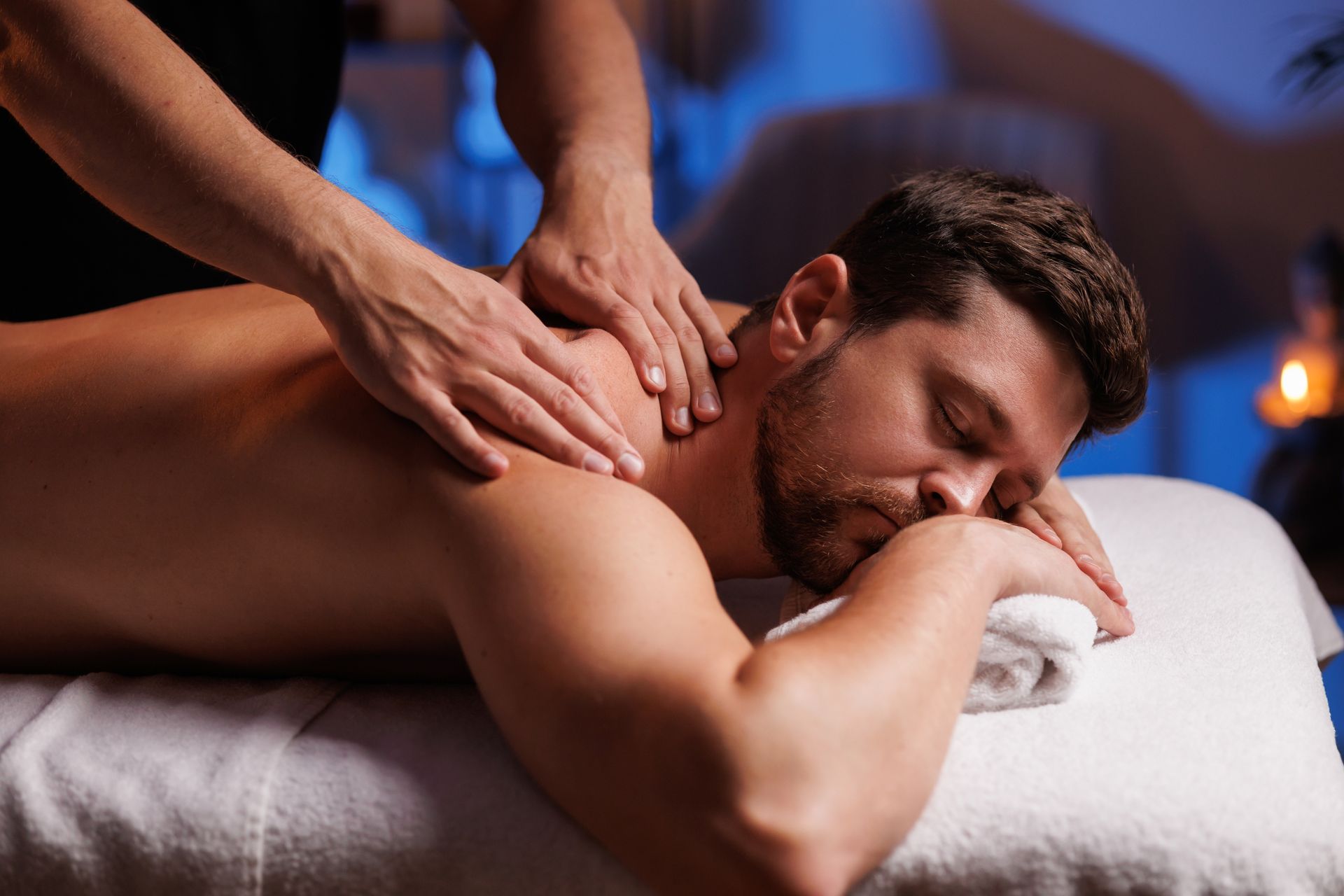 A man is getting a massage at a spa.