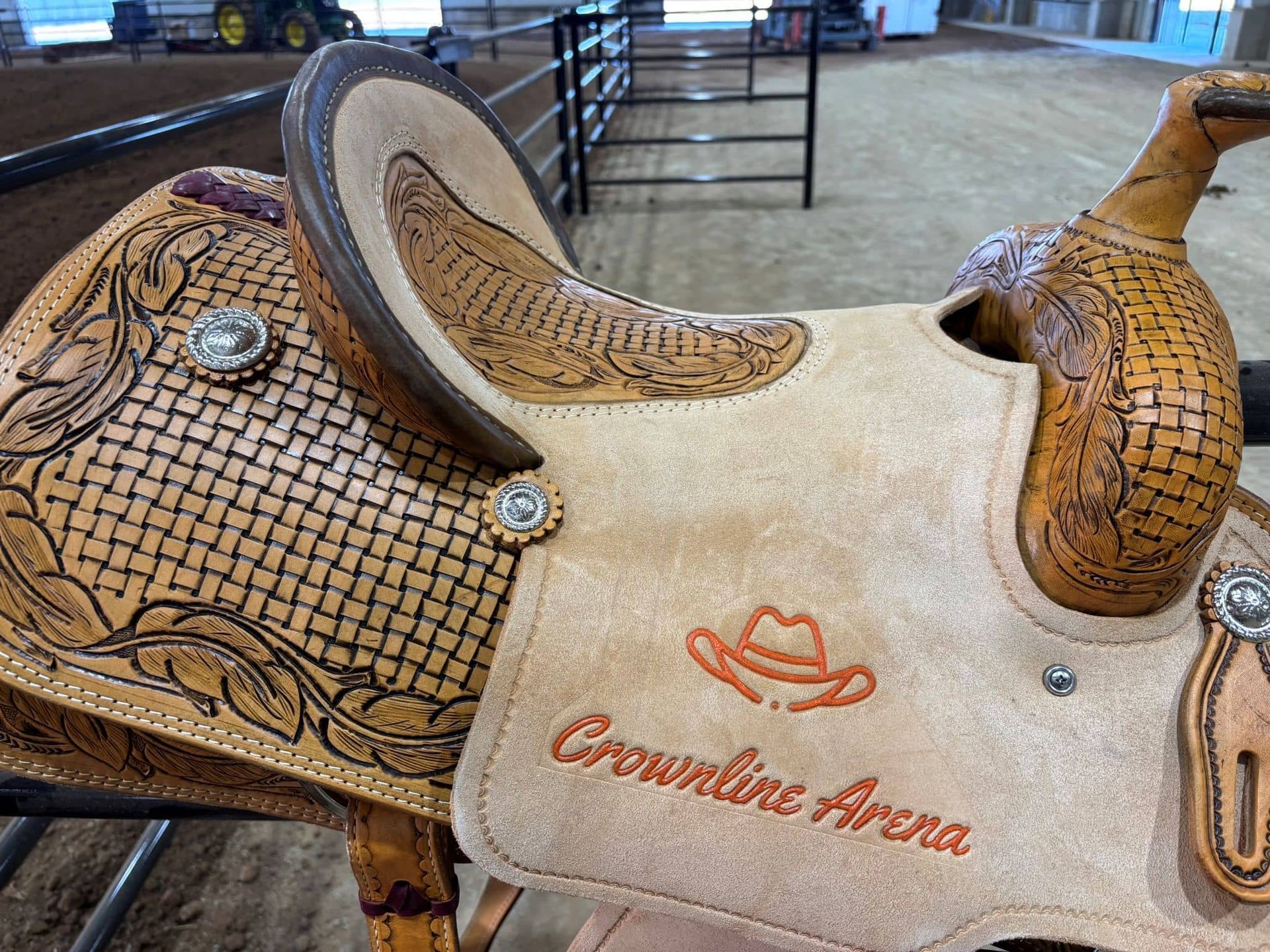 A close up of a saddle that says crownline arena on it