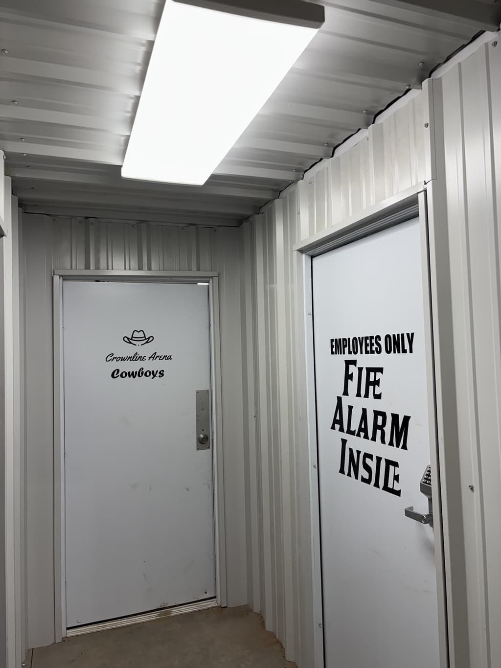 A hallway with a door that says 