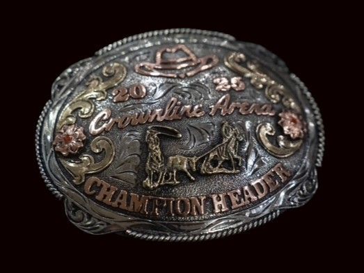 Silver belt buckle with gold and copper accents, reads 