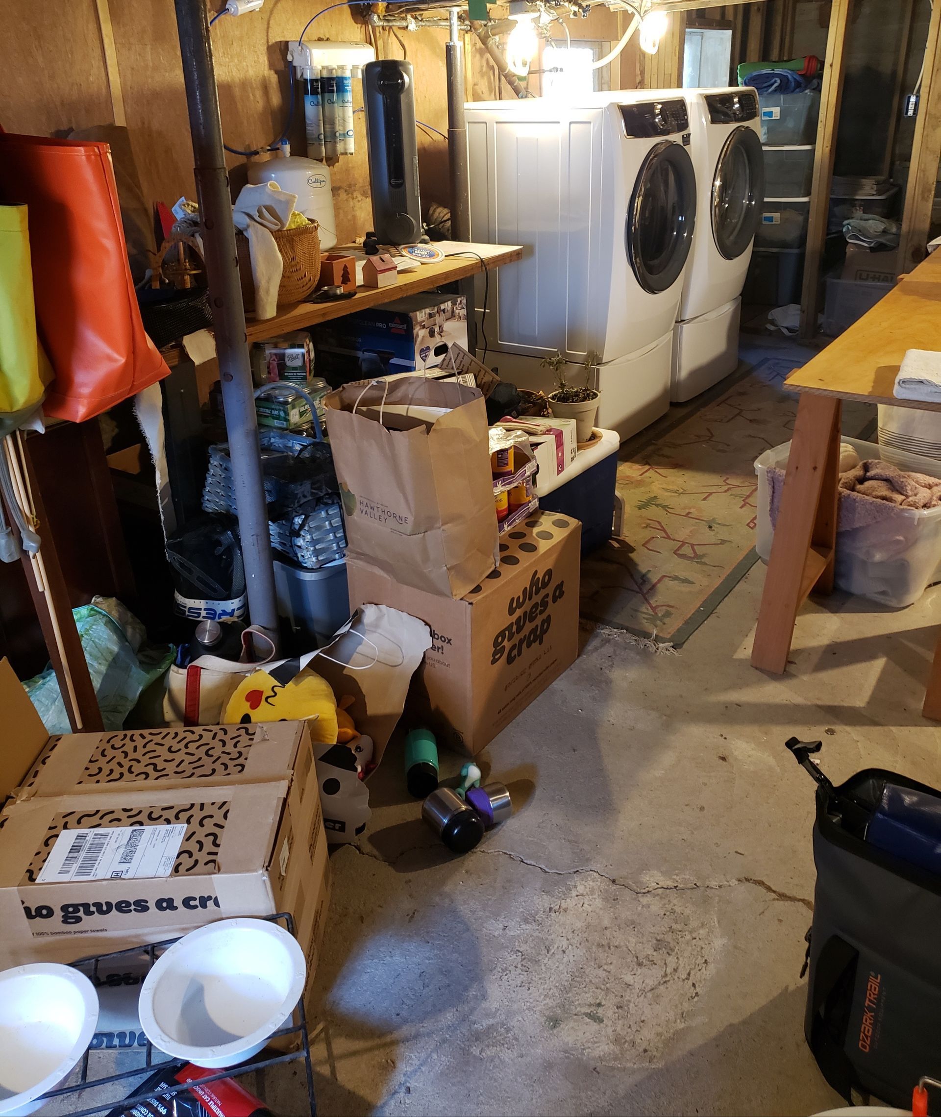 A laundry room with a box that says vegetables on it