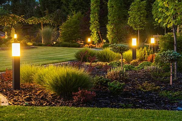 Garden Lamp in Garden at Night — Aurora, OR — Aspen Lawn & Sprinklers Inc.