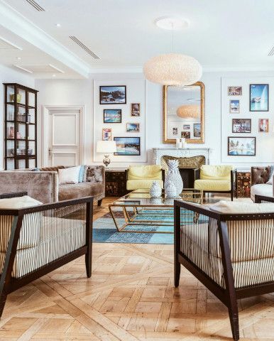 Dining table near a window shade, studio couch, four-poster bed, and patio.