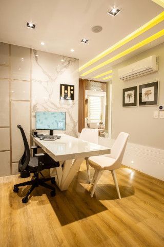 Patio with a barber chair, sliding door, desk, and space heater.