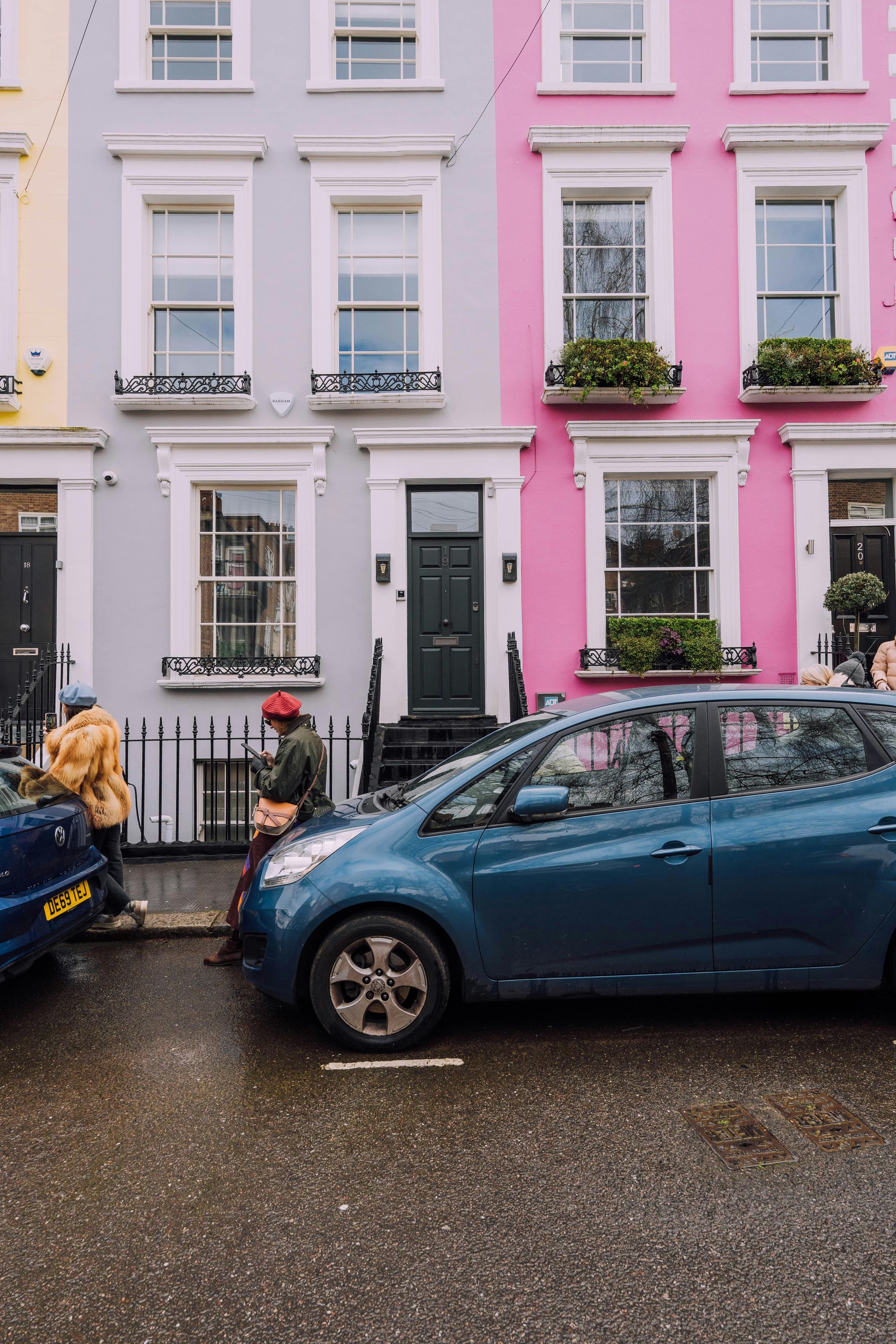 Lovely Sunderland flats. Exterior painted in pastel blue, yellow and pink by Foxglove Decor.