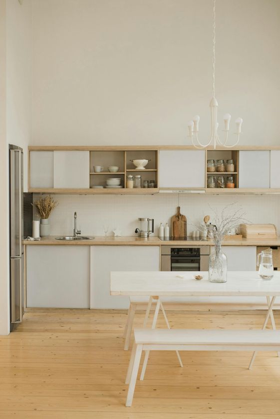 A quaint timeless kitchen with cute wooden and white finish.