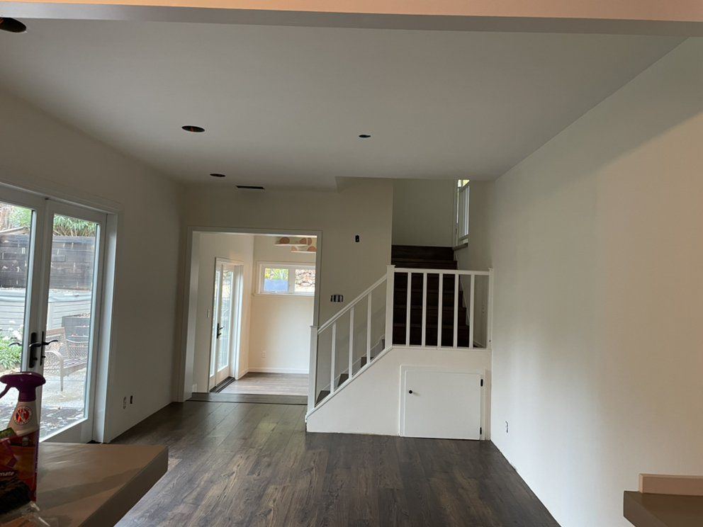 A large empty room with drywall on the walls and ceiling.