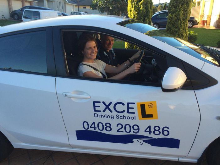 Student Driver and Instructor Smiling — Wollongong, NSW — Excel Driving School