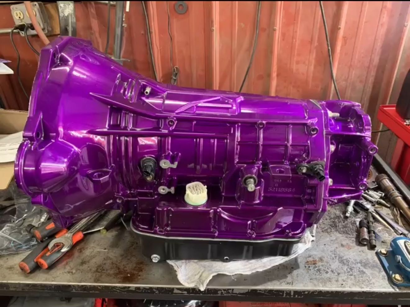 Close-up of car clutch parts: friction plate, pressure plate, and flywheel. Gears, metal, and mechanical components are visible. Close-up of car clutch parts: friction plate, pressure plate, and flywheel. Gears, metal, and mechanical components are visible.