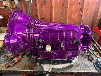 Close-up of car clutch parts: friction plate, pressure plate, and flywheel. Gears, metal, and mechanical components are visible. Close-up of car clutch parts: friction plate, pressure plate, and flywheel. Gears, metal, and mechanical components are visible.