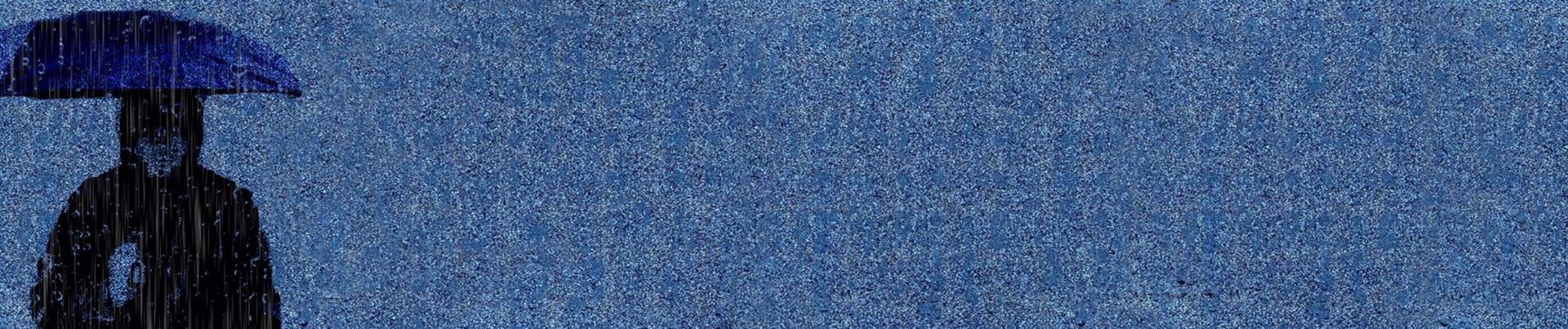 Person with blue umbrella walking in the rain.