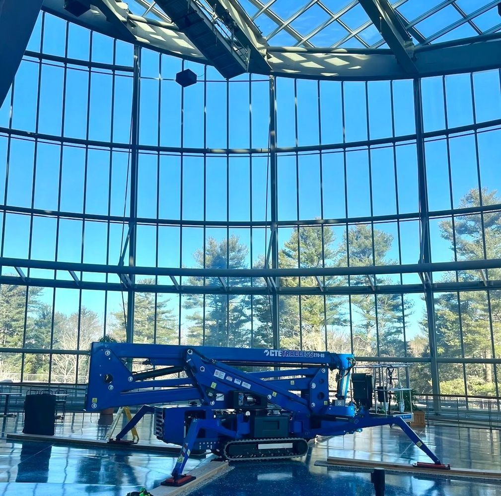 CTE Traccess is sitting in front of a large window