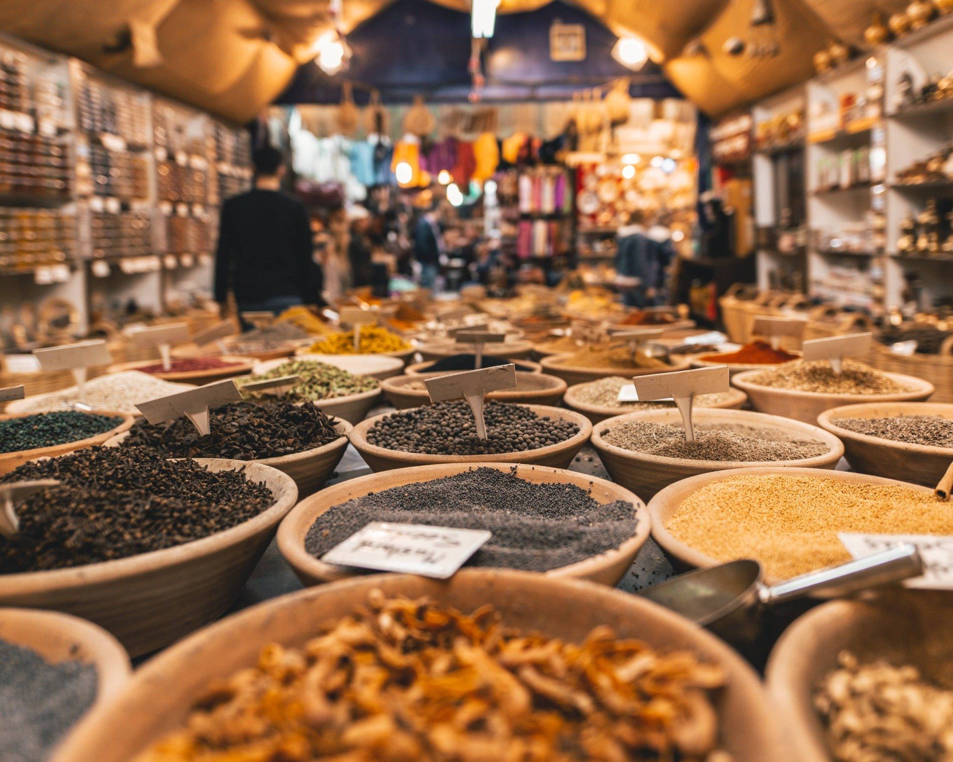 Eminönü, A bunch of bowls filled with different types of spices in a store.