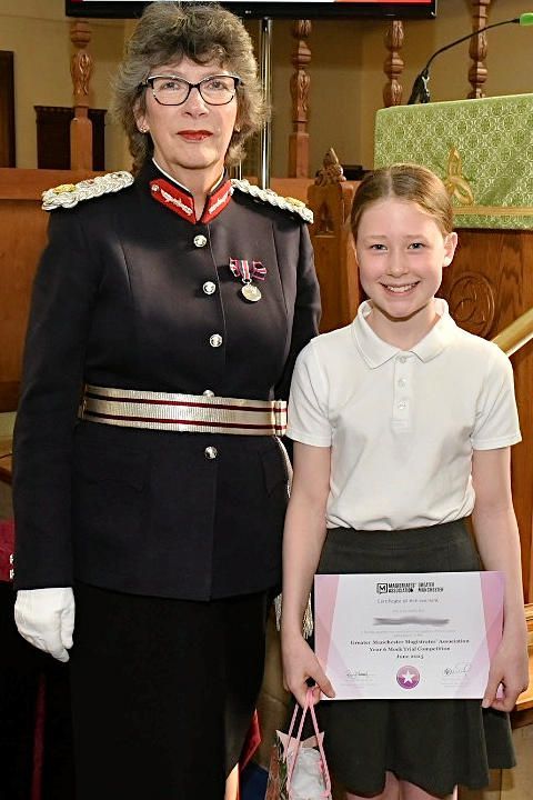 Court Reporter winner being presented with her prize by The Lord-Lieutenant of Greater Manchester