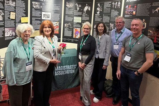 Picture showing some of the GM MIC team at the conference, with the award