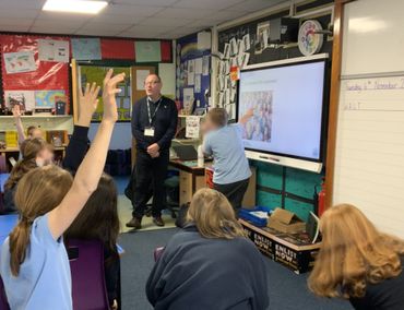 Picture of presentation to Micklehurst All Saints Promary in Mossley